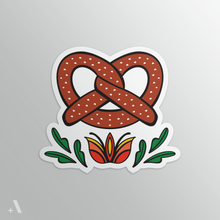 Load image into Gallery viewer, Soft Pretzel sticker showcasing a traditional Pennsylvania Dutch snack. Die-cut with a matte finish, this sticker is perfect for personalizing your kitchen, laptop, or water bottle.